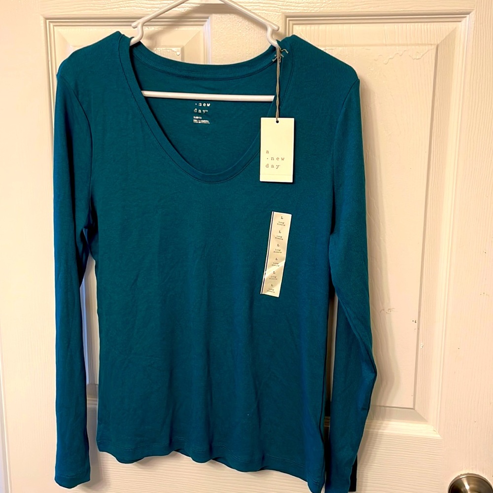 Teal colored long sleeved tee.